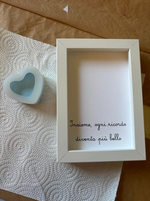Cornice con frase personalizzata e piccolo cuore azzurro